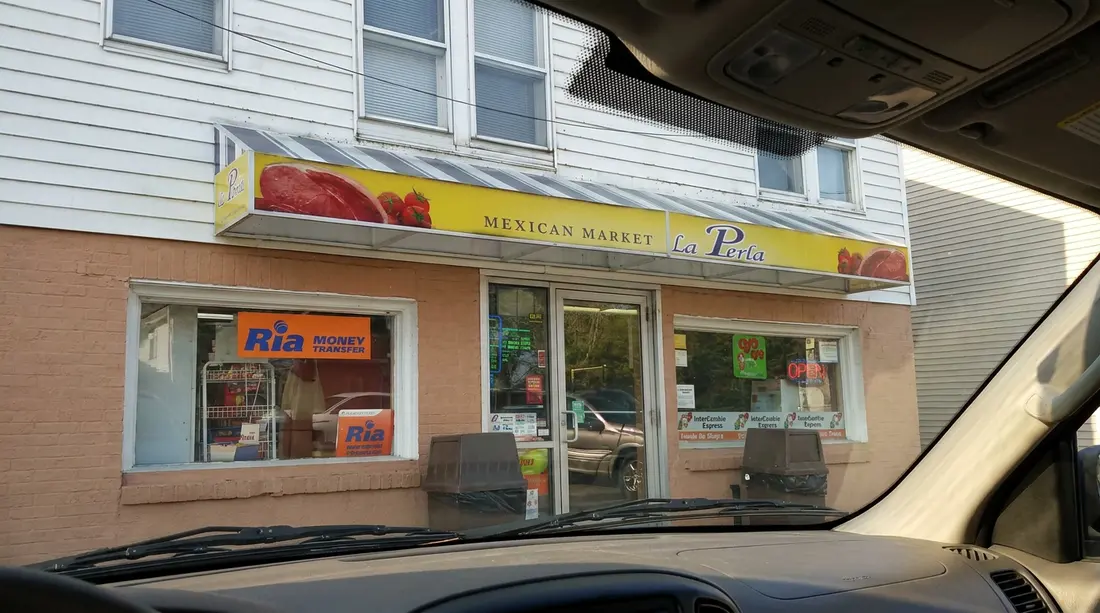 The front windows and entrance of La Perla Mexican Store